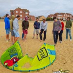 Expert instructor leading a kitesurfing lesson on the beach in Essex with Push Kiting
