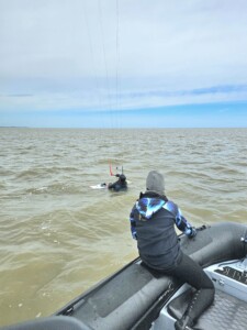 Winter kitesurfing with boat support on hand all the time